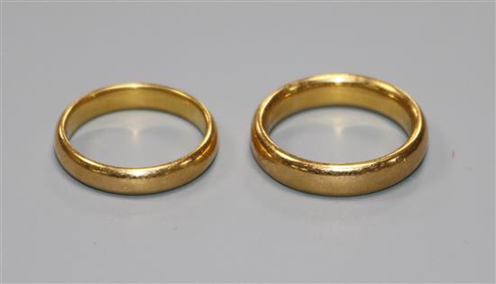 Two 22ct gold wedding bands.